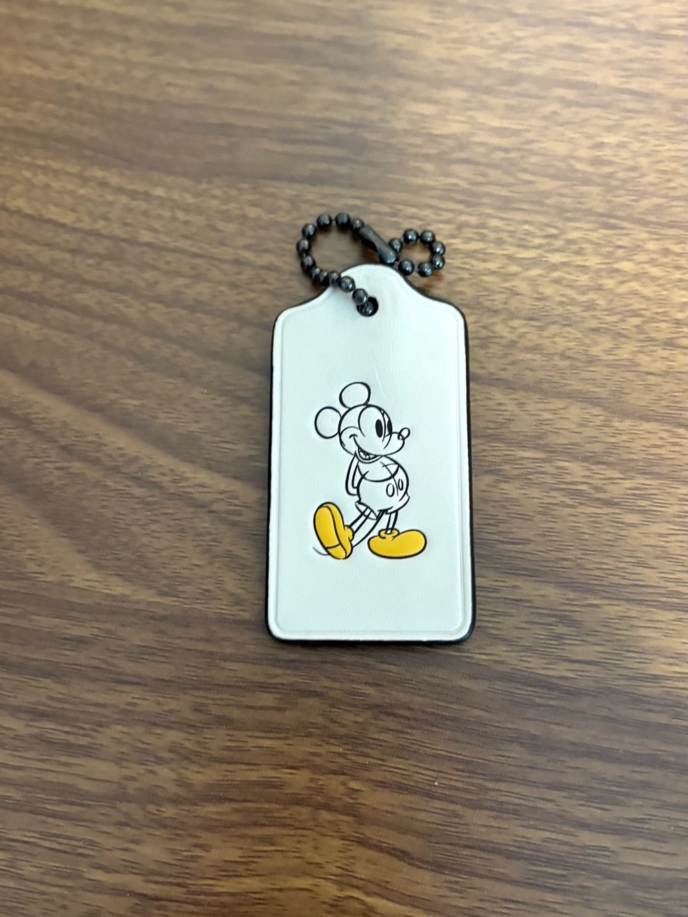 Coach White Mickey Mouse Leather Tag with Yellow Accent